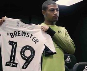 Photo: Liverpool's Rhian Brewster poses with Swansea City shirt