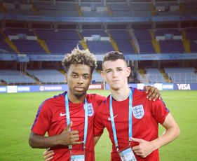 Man Utd's Angel Gomes and Man City's Phil Foden share the love