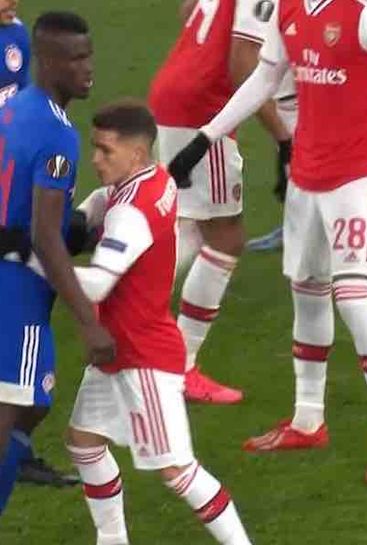 Photo: Arsenal's 5ft 5in Lucas Torreira marking Olympiacos' 6ft 3in Ousseynou Ba