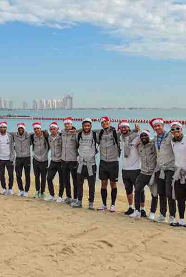 Photo: Liverpool players celebrate Club World Cup glory in Santa hats