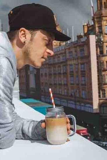 Photo: Mesut Ozil grabs a rooftop coffee