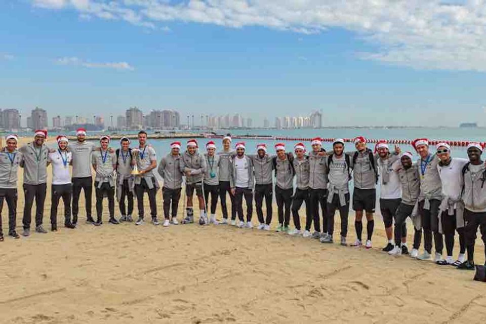 Photo: Liverpool players celebrate Club World Cup glory in Santa hats