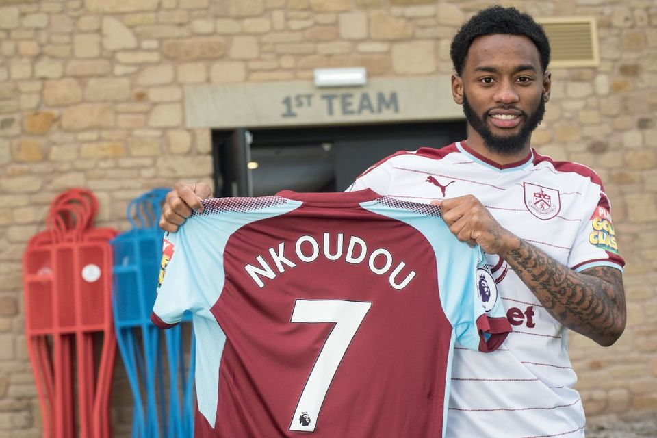 Photo: Spurs' Georges-Kevin Nkoudou poses with Burnley shirt after loan move